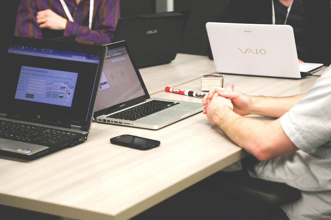 Business software planning session with laptops.